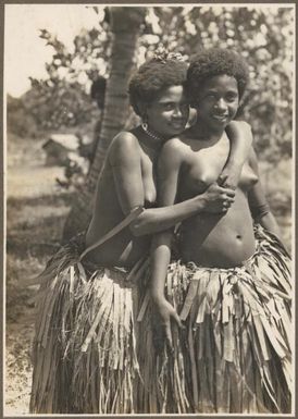 Girls from Mukawa [one girl has her arms around the other] Frank Hurley