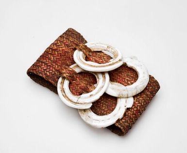 Braided rattan bracelet with shell decoration