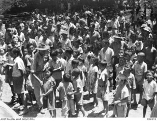 RABAUL, NEW BRITAIN, 1945-09-13. CHINESE CIVILIANS, INTERNED BY THE JAPANESE AT A CAMP 15 MILES WEST OF RABAUL, WERE CONTACTED BY A PARTY OF AUSTRALIAN ARMY AND RED CROSS OFFICIALS SOON AFTER THE ..