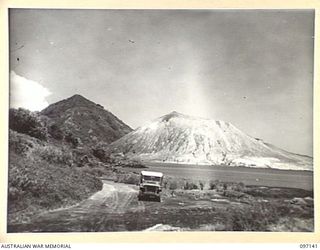 MATAPI, RABAUL, NEW BRITAIN. 1945-09-22. A VIEW PICTURING THE OLD MATAPI CRATER (RIGHT) AND THE SOUTH DAUGHTER (LEFT)