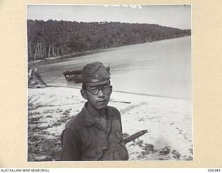 MUSCHU ISLAND, NEW GUINEA, 1945-09-08. A JAPANESE SECOND OFFICER BORN AND EDUCATED AT TOYAMA. JAPANESE SOLDIERS ON THE ISLAND, UNDER THE CONTROL OF HQ 6 DIVISION, ARE CONSTRUCTING THEIR OWN ..