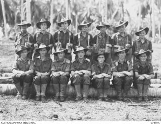 SIAR, NEW GUINEA. 1944-06-21. GROUP PHOTOGRAPH OF HEADQUARTERS, A COMPANY, 57/60TH INFANTRY BATTALION. IDENTIFIED PERSONNEL ARE:- VX89786 PRIVATE A. JONES (1); VX84576 PRIVATE D.F. MILLER (2); ..