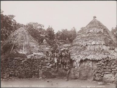 Women and children among round houses of Te Motu, Santa Cruz Islands, 1906, 1 / J.W. Beattie