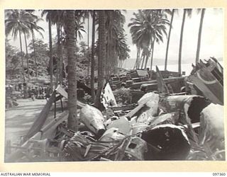 BUIN AREA, BOUGAINVILLE. 1945-09-28. THE CAMP AND EMBARKATION POINT WHERE JAPANESE TROOPS IN THE BUIN AREA AWAIT TRANSPORT TO FAURO ISLAND WHERE THEY WILL BE CONCENTRATED. THE SURRENDER PARTY FROM ..