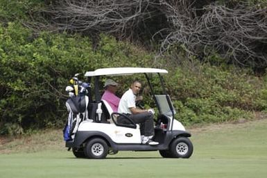 Barack Obama plays golf with Prime Minister Najib Razak, Joe Paulsen, and Mike Brush in Kaneohe Bay, Hawaii, December 24, 2014