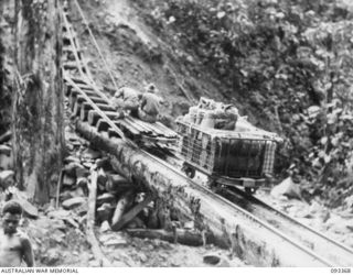 BARGES HILL, CENTRAL BOUGAINVILLE, 1945-06-26. THE BEGINNING OF THE FUNICULAR RAILWAY BEING CONSTRUCTED BY 23 FIELD COMPANY, ROYAL AUSTRALIAN ENGINEERS, WHICH TRANSPORTS SUPPLIES OVER THE RIDGE TO ..