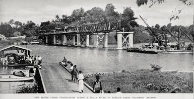 New bridge under construction across a Fijian river to replace ferry transport methods