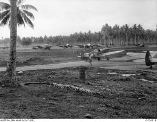 MILNE BAY, PAPUA. C. 1942-10/11. AIRCRAFT OF NO. 75 (KITTYHAWK) SQUADRON RAAF, NO. 100 (BEAUFORT) SQUADRON RAAF AND NO. 30 (BEAUFIGHTER) SQUADRON RAAF AT GURNEY AIRSTRIP