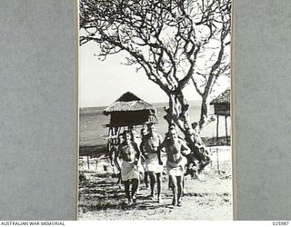 PORT MORESBY, PAPUA. 1942-07-20. HAVING ENJOYED A SWIM AFTER A DAY'S WORK, THESE AUSTRALIAN TROOPS LOOSEN UP WITH A BRISK RUN ALONG THE BEACH