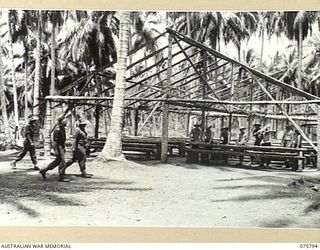 SIAR-NAGADA, NEW GUINEA. 1944-09-08. A MESS HUT UNDER CONSTRUCTION AT HEADQUARTERS COMPANY, 61ST INFANTRY BATTALION "THE QUEENSLAND CAMERON HIGHLANDERS"