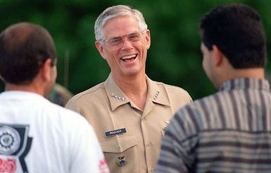 US NAVY Admiral (ADM) Joseph W. Prueher, Commander in CHIEF U.S. Pacific Command, laughs with Kurdish evacuees while touring Andersen AFB, Guam, during OPERATION PACIFIC HAVEN. Pacific Haven, a joint humanitarian operation conducted by the U.S. Military, evacuated over 2,100 Kurds from Northern Iraq. The evacuees will be housed temporarily at Andersen AFB, Guam, while they go through the immigration process for residence into the United States