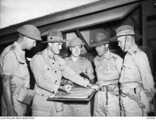 PORT MORESBY, PAPU, 1942-07. GROUP OF OFFICERS OF 30TH AUSTRALIAN INFANTRY BRIGADE. LEFT TO RIGHT:- LIEUTENANT-COLONEL O.A. KESSELS, OFFICER COMMANDING 49TH AUSTRALIAN INFANTRY BATTALION, BRIGADIER ..