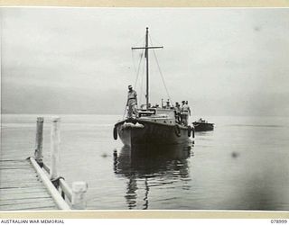 MALMAL VILLAGE, NEW BRITAIN. 1945-02-09. AM1439 THE LAUNCH OF THE GENERAL OFFICER COMMANDING, 5TH DIVISION PULLING INTO THE VILLAGE WHARF WITH VX63396 LIEUTENANT GENERAL J. NORTHCOTT, CB, MVO, ..