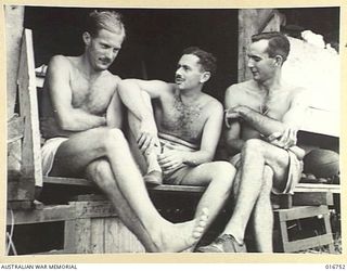 1944-03-29. NEW GUINEA. BACK FROM A MISSION OVER JAPANESE HELD KAIRIRU ISLAND, NEAR WEWAK, FLIGHT OFFICER K. JOHNSTON OF MANLY, N.S.W. F/LT. W. REHFISCH OF CAULFIELD, VIC, AND F/O. J. O'KEEFE OF ..