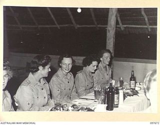 LAE, NEW GUINEA. 1945-10-05. MEMBERS OF THE OFFICIAL TABLE AT THE FORMAL MESS HELD BY QUEENSLAND AUSTRALIAN ARMY MEDICAL WOMEN'S SERVICE PERSONNEL OF 2/7 GENERAL HOSPITAL TO CELEBRATE THE ..