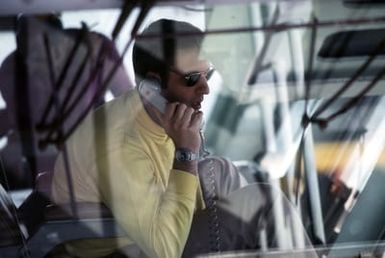 LCDR Gene Gilbert monitors flight operations by phone aboard the amphibious assault ship USS SAIPAN (LHA-2). The SAIPAN is taking part in exercise Ocean Venture '81