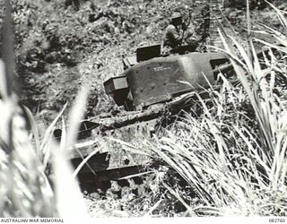 MADANG, NEW GUINEA. 1944-10. A CHURCHILL VII TANK ENGAGED IN ITS SECOND ATTEMPT AT COURSE NO. 3 DURING TESTS CONDUCTED AT HQ 4 ARMOURED BRIGADE