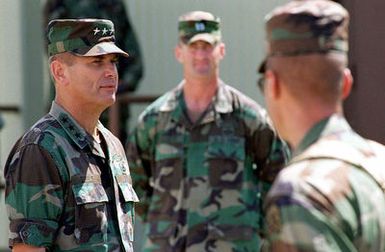 Lieutenant General (LGEN) William M. Steele, Commanding General US Army Pacific, Fort Shafter, Hawaii, talks with US Army Soldiers operating at Andersen Air Force Base, Guam, during Operation Pacific Haven. OPERATION PACIVIC HAVEN provides airlift for some 2,700 refugees fleeing Iraq. The refugees will be housed at Anderson AFB, Guam, while they go through the immigration process for residence into the United States