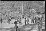 Pig festival, pig sacrifice, Kompiai: armed and decorated allies approach the ritual fence with mock aggression