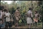 Maenaa'adi, Dangeabe'u and young men standing in front of men's house, performing ritual