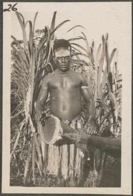 Tolai man with a tom-tom, New Britain Island, Papua New Guinea, approximately 1916