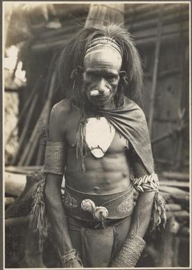 Types from the villages of Urama, Kinomere & Tovei [Man standing with his head lowered]