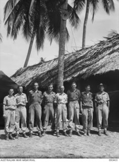 BEACH HEAD HEADQUARTERS STAFF, 7 DOCKS OPERATING COMPANY, ROYAL AUSTRALIAN ENGINEERS. THESE MEN ARE THE "NERVE CENTRE" OF OPERATIONS IN THE PORT WHERE A 24 HOUR LOADING STORES, EQUIPMENT AND ..