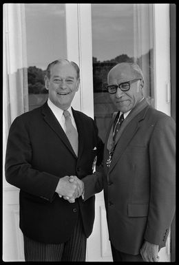 Governor-General Sir Keith Holyoake shakes hands with the Premier of Niue, Mr Robert Rex