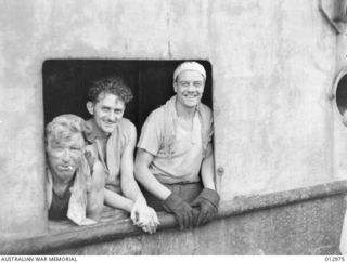THREE OF THE CREW OF THE SHIP WHICH BROUGHT BACK THE SURVIVORS OF THE "MACDHUI", SUNK IN PORT MORESBY ON 18 JUNE 1942. (NEGATIVE BY ANDERSON)