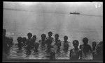 Group of children and adults inside the beach