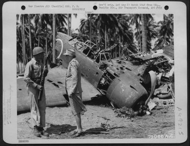 During Her Tour Of The Pacific Area Mrs. F. D. Roosevelt Chats With Pvt. Clarence D. Robertson From Tulsa, Okla, Who Guards A Wrecked Jap Zero At Guadalcanal, Solomon Islands, 1943. (U.S. Air Force Number 75086AC)