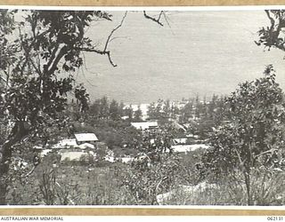 ELA BEACH, PORT MORESBY AREA, NEW GUINEA. 1943-12-29. ADMINISTRATIVE BUILDINGS ON ELA BEACH. THE CENTRE LONG BUILDING ON ELA BEACH IS "SHANGRALA" THE AMERICAN RED CROSS HEADQUARTERS FOR THE AREA