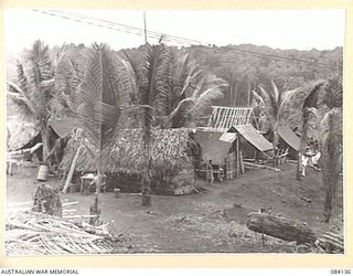 WUNUNG PLANTATION, JACQUINOT BAY, NEW BRITAIN. 1944-12-08. THE ADMINISTRATIVE AREA AND BUILDINGS OF THE ALLIED INTELLIGENCE BUREAU BASE SUB AREA