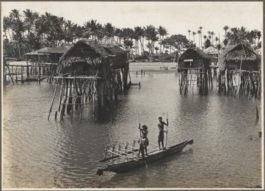 [Two men in a canoe] Hula Village, Papua New Guinea