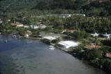 French Polynesia, waterfront buildings on shore of Raiatea