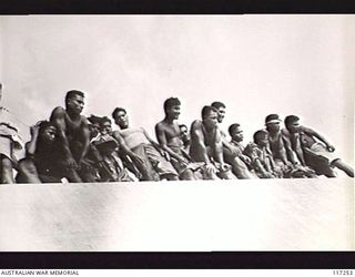 NAURU ISLAND. 1945-09-13. NAURUANS TAKING A KEEN INTEREST IN THE JAPANESE SURRENDER CEREMONY ABOARD THE ROYAL AUSTRALIAN NAVY VESSEL HMAS DIAMANTINA