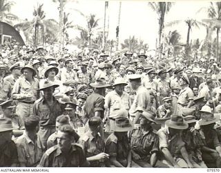 ALEXISHAFEN, NEW GUINEA. 1944-08-31. A SECTION OF THE LARGE CROWD OF ALLIED SERVICE PERSONNEL WAITING FOR THE COMMENCEMENT OF THE CONCERT STAGED BY THE BOB HOPE CONCERT PARTY