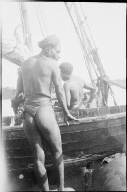 Man standing beside Wauchope's schooner Balangot, Awar, Sepik River, New Guinea, 1935, 2 / Sarah Chinnery