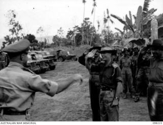 KARAVIA BAY, NEW BRITAIN, 1945-10-22. MAJOR-GENERAL K.W. EATHER, GENERAL OFFICER COMMANDING (GOC) 11 DIVISION (1), PAID A VISIT TO THE INDIAN EX-PRISONER OF WAR CAMP AT KARAVIA BAY. HE IS SHOWN ..