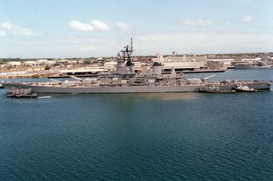 A port beam view of the battleship USS NEW JERSEY (BB 62) in port