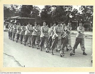 ENOGGERA, QUEENSLAND. 1945-04-26. AUSTRALIAN WOMEN'S ARMY SERVICE BARRACK, WHO ARE ON OVERSEA DRAFT FOR NEW GUINEA, MARCHING DURING AN INSPECTION BY THE CONTROLLER OF AUSTRALIAN WOMEN'S ARMY ..