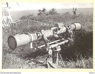 KANGU HILL, BOUGAINVILLE. 1945-10-05. A JAPANESE RANGE FINDER AT AN ANTI-AIRCRAFT OBSERVATION POST. IT PROTECTED THE AERIAL APPROACH TO THE BUIN AREA. TROOPS OF HEADQUARTERS 2 CORPS NOW OCCUPY THE ..
