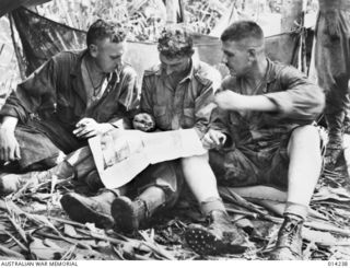 1943-01-27. PAPUA. SANANANDA AREA. AN ARTILLERY ATTACK ON JAPANESE PILLBOXES IS PLANNED AT SANANANDA BY COLONEL H.M. LINDSTROM OF BILLINGS, MONTANA, LIEUTENANT J. LEWITZ OF SYDNEY AND CAPTAIN C. S. ..