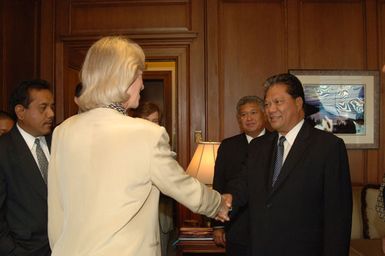 Marshall Islands President Kessai Note, shown at right shaking hands with Secretary Gale Norton, visiting Department of Interior headquarters for meeting with the Secretary