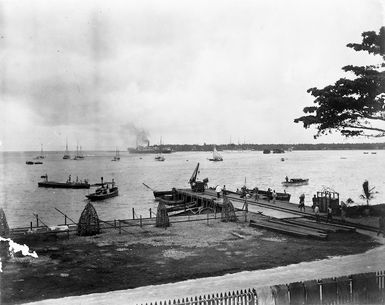 The wharf at Apia, Samoa with several boats in and around the harbour