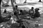 Women preparing pandanus fibres for group mat-planting project