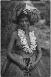 New mother wearing long fiber skirts, flower garland, skirt valuable on head, and paint on face