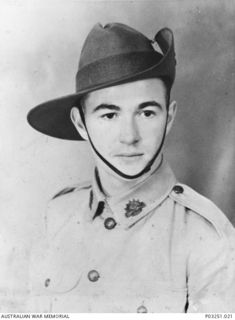 Studio portrait of NX191455 Gunner (Gnr) Earl James Arrow, Anti Aircraft Battery Rabaul, of Parkes, NSW. He enlisted in Moore Park, NSW, on 23 April 1941. Gnr Arrow was taken prisoner of war (POW) ..