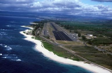 An aerial view, looking east, of Dillingham Air Force Base. Located on the north shore of the island, the field is used for touch and go landings, the Air Force parachute team and the glider club