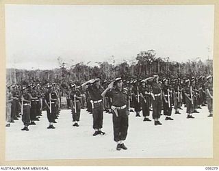 WEWAK, NEW GUINEA. 1945-10-26. A CEREMONIAL PARADE AND MARCH PAST BY 6 DIVISION WAS INSPECTED BY GENERAL SIR THOMAS A. BLAMEY, COMMANDER-IN-CHIEF, ALLIED LAND FORCES, SOUTH WEST PACIFIC AREA, AT ..